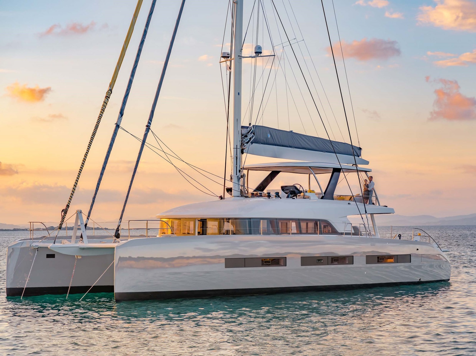 Catamaran anchored at sunset